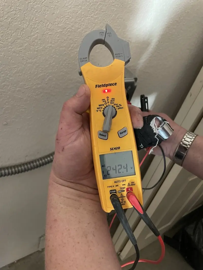 Voltage testing with clamp meter during Whole House Surge Protector in Hampstead